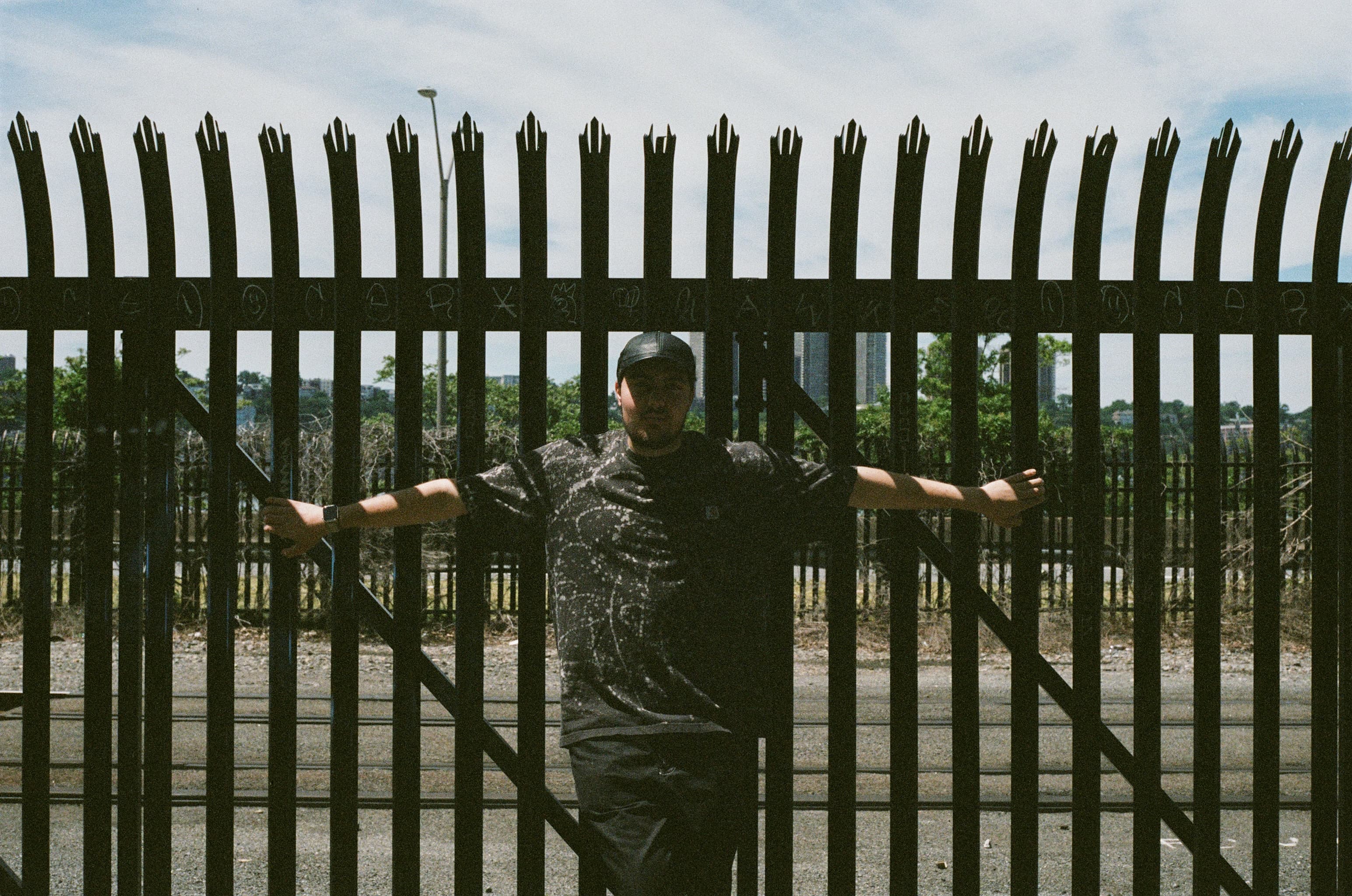 Lorenzo against an iron gate